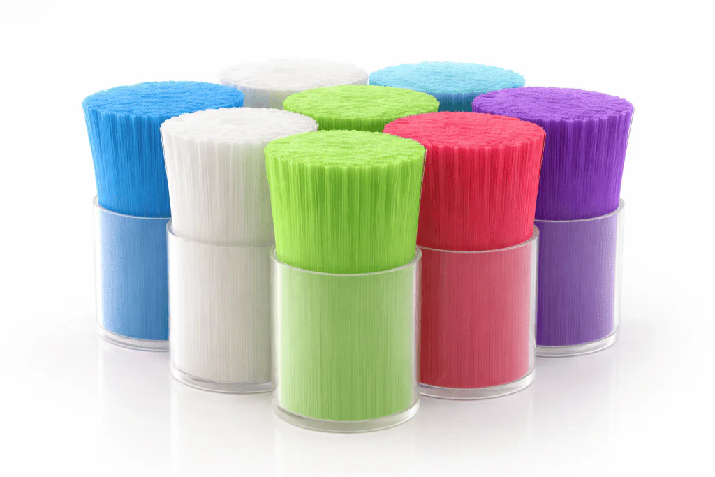 Monofilament bristles in various colors for oral care toothbrushes.